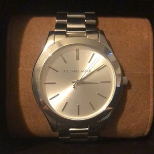Never been worn Michael Kors watch. Needs battery